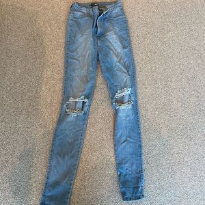 High waisted, destroyed skinny jeans